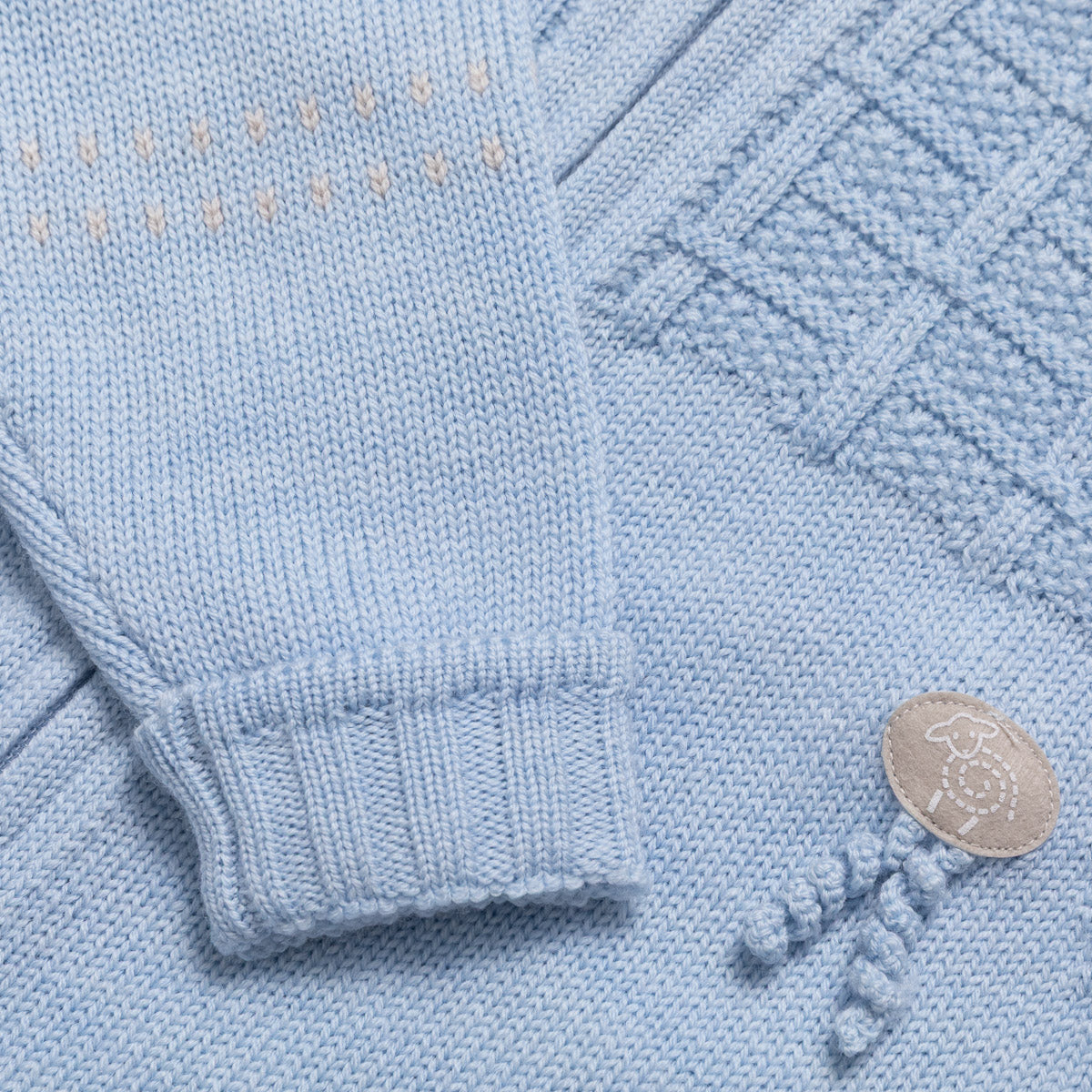 Lillelam Sparkedress i merinoull «Classic» Himmelblå detalj